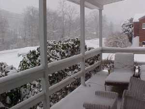 snow covered road and porch